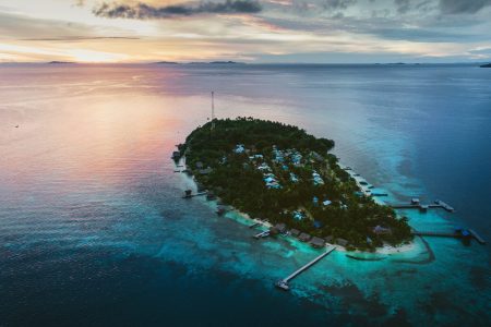 Arborek is an inhabited atoll island within Raja Ampat Regency West Papua.